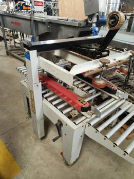Maquina selladora de cajas de cart�n Strapack